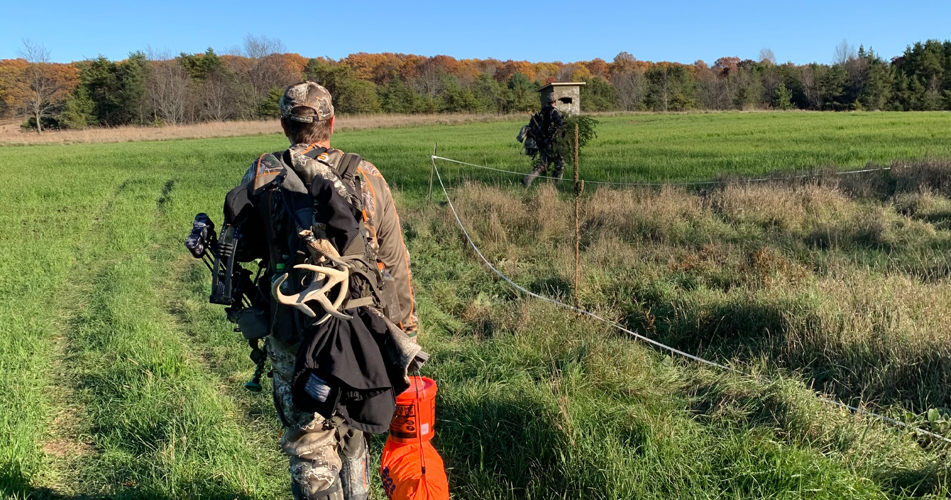 Hunter reviewing AHLA vs NDA hunting lease insurance options before purchasing a policy